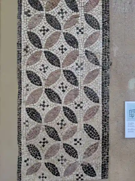 Ancient Roman mosaic floor fragment with interlocked leaf-circle pattern from a dining room in Anaploga, Corinth, 2nd-3rd century AD